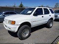 1999 Isuzu Rodeo — photo 2 of 11 | VIN 4S2CM58WXX4361122
