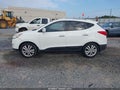 2011 Hyundai Tucson — photo 14 of 16 | VIN KM8JU3AC2BU296780