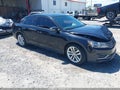 2019 Volkswagen Passat — photo 1 of 16 | VIN 1VWLA7A35KC005575