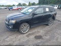2014 Jeep Compass — photo 2 of 15 | VIN 1C4NJCCB2ED572866