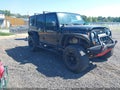 2011 Jeep Wrangler Unlimited — photo 1 of 16 | VIN 1J4BA6H10BL551403
