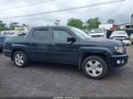 2013 Honda Ridgeline — photo 13 of 18 | VIN 5FPYK1F54DB002516