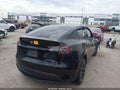 2022 Tesla Model Y — photo 4 of 15 | VIN 7SAYGDEE3NF331340