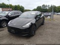2021 Tesla Model Y — photo 2 of 16 | VIN 5YJYGDEE0MF208185