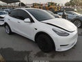 2020 Tesla Model Y — photo 1 of 15 | VIN 5YJYGDEE4LF026374