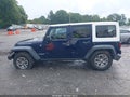 2013 Jeep Wrangler Unlimited — photo 14 of 16 | VIN 1C4HJWFG0DL560211