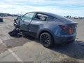2022 Tesla Model Y — photo 3 of 16 | VIN 7SAYGAEE1NF560517