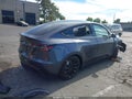 2022 Tesla Model Y — photo 4 of 16 | VIN 7SAYGAEE1NF560517