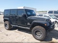 2012 Jeep Wrangler Unlimited — photo 13 of 16 | VIN 1C4BJWEG1CL125154