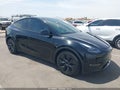 2025 Tesla Model Y — photo 1 of 18 | VIN 7SAYGAEE4SF311365