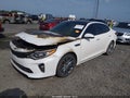 2018 Kia Optima — photo 2 of 12 | VIN 5XXGV4L26JG181044