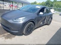 2024 Tesla Model Y — photo 2 of 15 | VIN 7SAYGDEE1RA275238