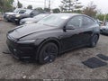 2026 Tesla Model Y — photo 2 of 15 | VIN 7SAYGDEE8TA488713