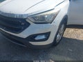 2014 Hyundai Santa Fe — photo 16 of 18 | VIN 5XYZWDLA4EG140099