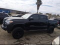 2017 Toyota Tacoma — photo 14 of 16 | VIN 5TFAX5GN2HX089894