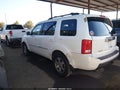 2011 Honda Pilot — photo 14 of 16 | VIN 5FNYF3H98BB057119