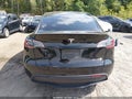 2023 Tesla Model Y — photo 16 of 18 | VIN 7SAYGDEF4PF915077