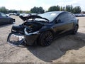 2023 Tesla Model Y — photo 2 of 18 | VIN 7SAYGDEF4PF915077