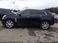 2015 Cadillac SRX — photo 13 of 16 | VIN 3GYFNFE33FS600170