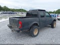2001 Nissan Frontier — photo 4 of 11 | VIN 1N6ED27T11C398418