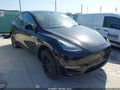 2023 Tesla Model Y — photo 1 of 17 | VIN 7SAYGDEE3PA107999
