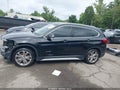 2016 BMW X1 — photo 14 of 16 | VIN WBXHT3C37GP889871