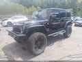 2014 Jeep Wrangler Unlimited — photo 2 of 16 | VIN 1C4BJWDG3EL294998