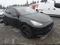 2023 Tesla Model Y — photo 1 of 20 | VIN 7SAYGAEE5PF604571