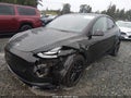 2023 Tesla Model Y — photo 2 of 20 | VIN 7SAYGAEE5PF604571