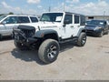 2011 Jeep Wrangler Unlimited — photo 2 of 16 | VIN 1J4BA6H10BL536027