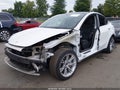2023 Tesla Model Y — photo 2 of 15 | VIN 7SAYGDEE3PF798700