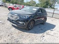 2018 Hyundai Santa Fe — photo 2 of 12 | VIN 5NMZUDLB3JH096370
