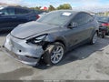 2023 Tesla Model Y — photo 2 of 18 | VIN 7SAYGAEE7PF926208