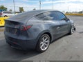 2023 Tesla Model Y — photo 4 of 18 | VIN 7SAYGAEE7PF926208