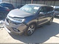 2018 Honda Pilot — photo 2 of 16 | VIN 5FNYF6H62JB043710