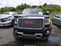 2016 GMC Sierra — photo 12 of 15 | VIN 1GT12UE8XGF255783