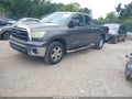 2011 Toyota Tundra — photo 2 of 16 | VIN 5TFRM5F11BX023869
