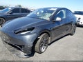 2024 Tesla Model Y — photo 2 of 15 | VIN 7SAYGDED2RF116917