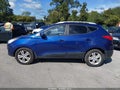 2011 Hyundai Tucson — photo 14 of 21 | VIN KM8JUCAC6BU227140