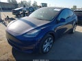 2023 Tesla Model Y — photo 2 of 19 | VIN 7SAYGDEE6PA092673