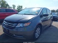 2014 Honda Odyssey — photo 2 of 17 | VIN 5FNRL5H47EB028759
