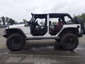 2009 Jeep Wrangler Unlimited — photo 14 of 16 | VIN 1J4GA391X9L711459