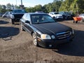 2004 Kia Optima — photo 1 of 16 | VIN KNAGD128645299916