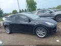 2023 Tesla Model Y — photo 12 of 18 | VIN 7SAYGDEE4PA109812