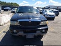 2000 Lincoln Navigator — photo 12 of 16 | VIN 5LMFU28A8YLJ30294