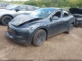 2026 Tesla Model Y — photo 2 of 15 | VIN 7SAYGDEDXTF518353