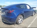 2023 Tesla Model Y — photo 4 of 18 | VIN 7SAYGAEEXPF674325