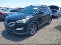 2016 Hyundai Santa Fe — photo 2 of 16 | VIN 5XYZU3LB1GG306672