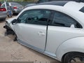 2014 Volkswagen Beetle — photo 13 of 15 | VIN 3VWJL7AT0EM656746