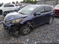 2012 Honda CR-V — photo 2 of 16 | VIN 5J6RM4H7XCL013694
